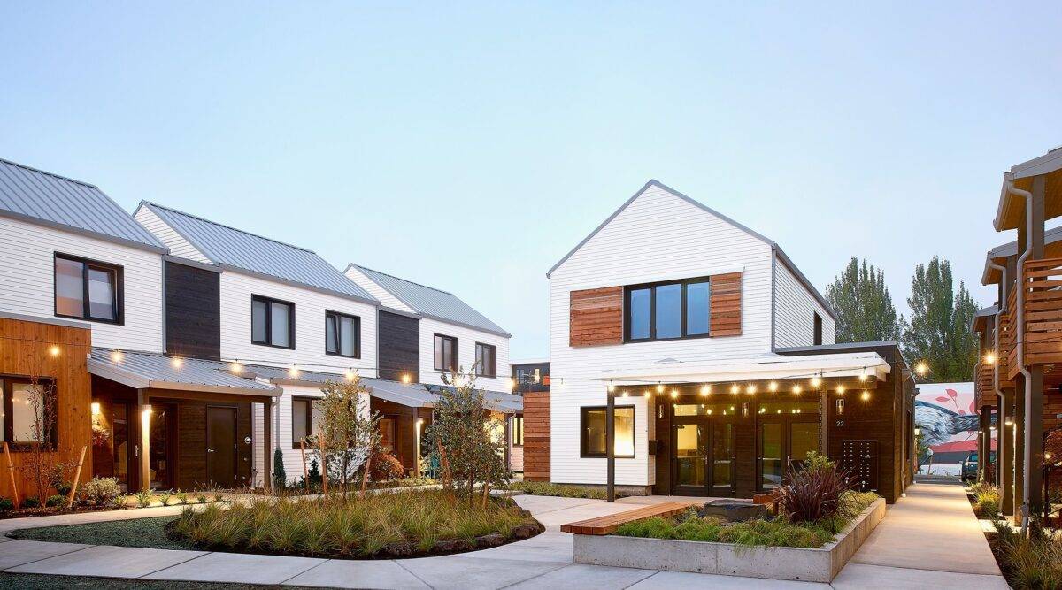 Central Courtyard and common building at Tillamook Row development in Portland, Oregon with view of community mural.