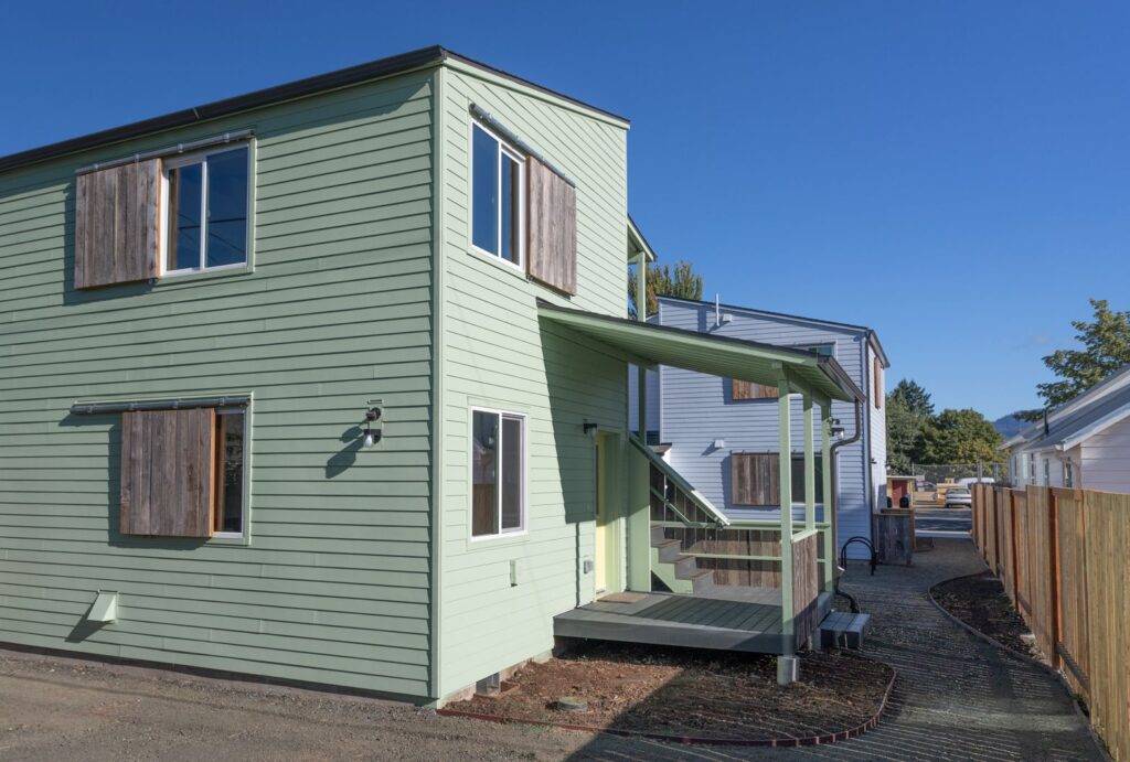 Rear view of back porch of duplex at C St development in Springfield, Oregon.